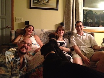 family sitting on couch